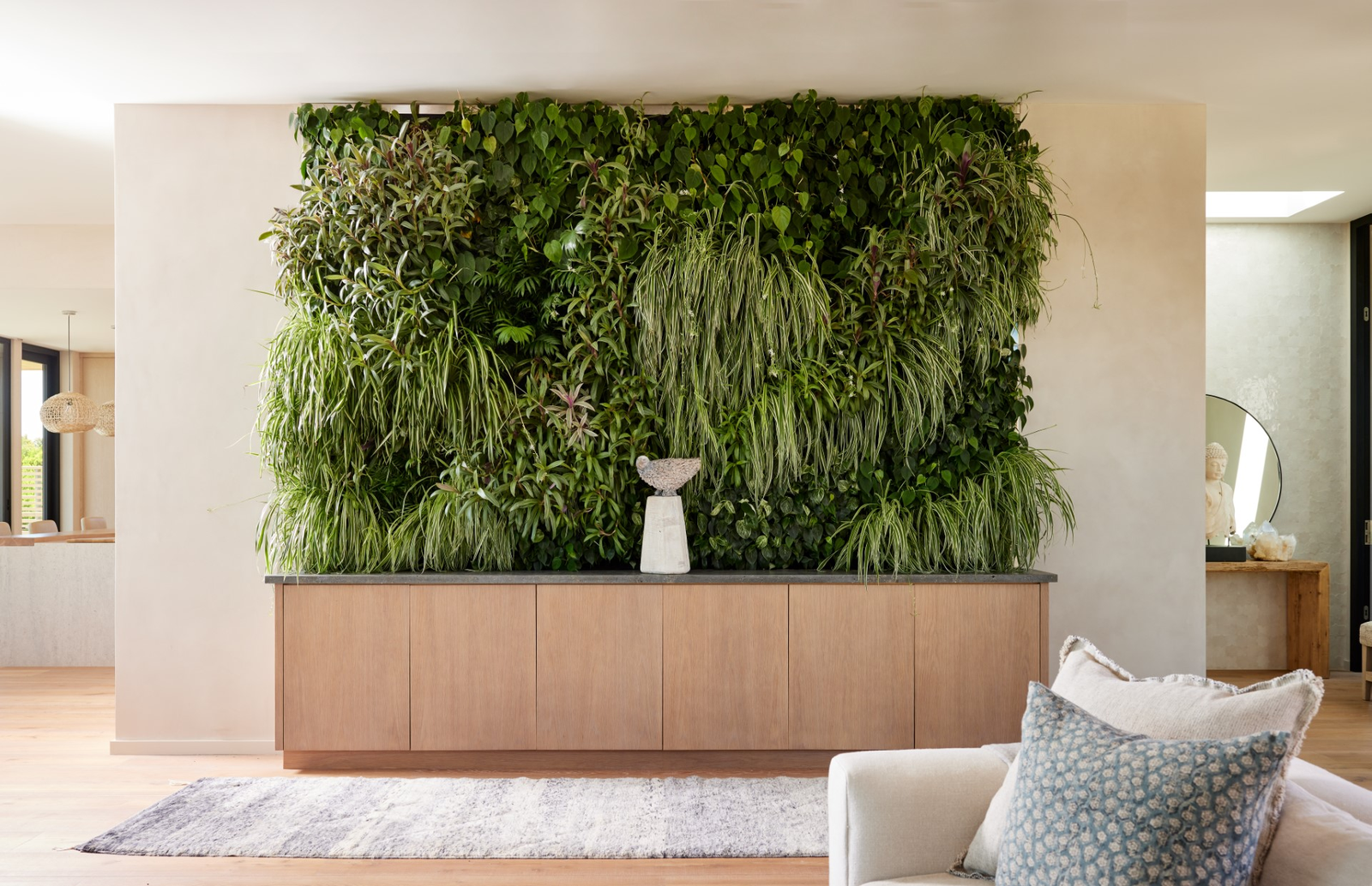 A living plant wall featured in a Skornicka Designs amp Construction Inc. project pictured with a True Guardian...