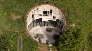 Aerial photo of a home built into a hill